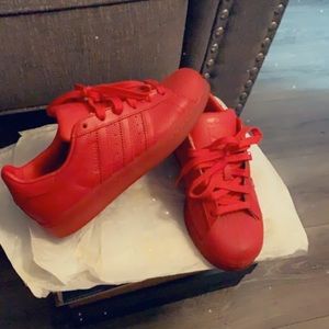All Red Adidas sneakers